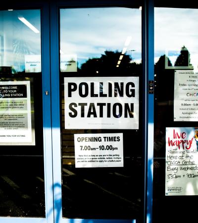 Photograph of a door with a polling station sign