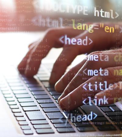 hands typing hands type on laptop with coding text image overlaid