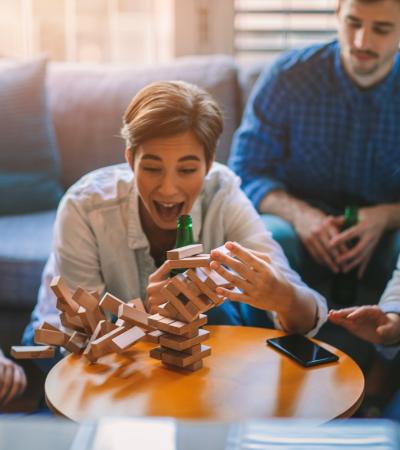 game  friends playing jenga game