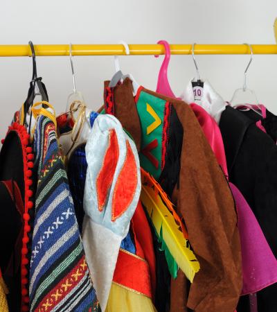 colorful costumes hang on a rack