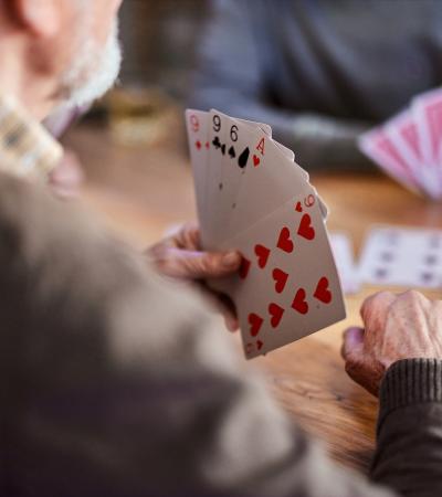 playing cards at a wooden table