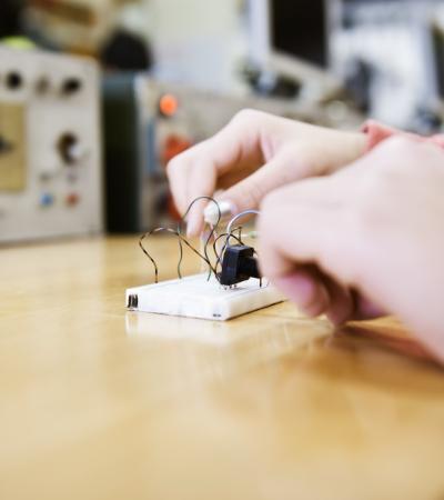 electronics young adult experimenting with electronic equipment