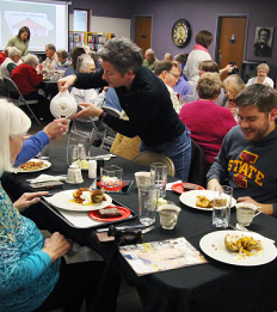 Patrons at Slater Public Library share a meal and prepare to listen to entertainment at Soup and Sound
