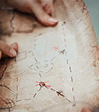 Hands holding a treasure map