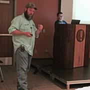 Speaker and son presenting about chicken coops
