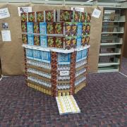A building made from bottled water and cereal boxes. 