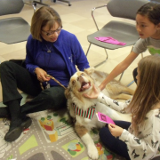 Dog and owner with two children Dog and owner with two children