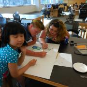 Teens working on electric paint project Teens working on electric paint project