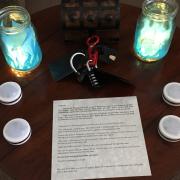 Table with instructions, locks, and candles
