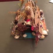 Fairy house created with lots of dried flowers