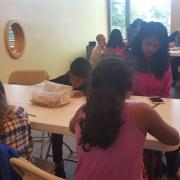 Young patrons write during the poetry workshop Young patrons write during the poetry workshop