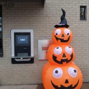 Photograph of inflatable Jack O' Lanterns outside of the library.