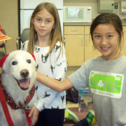 White dog with two children White dog with two children