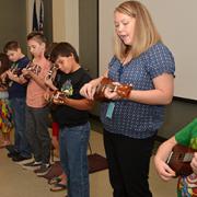 Instructors teach students how to play the instrument in groups and in one-on-one sessions.
