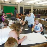 Teens drawing their electric paint designs Teens drawing their electric paint designs