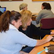 Teen Tech Tutors Teenager and woman working on a laptop