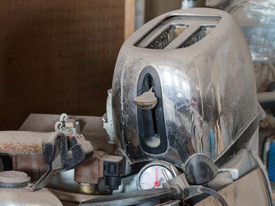 An old, dusty toaster ready for repair