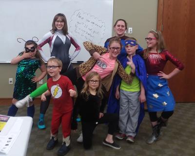A group photo from the superhero program series