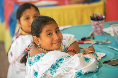 Girl making craft at Hispanic Heritage Month event