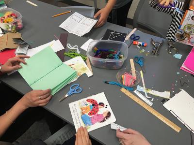 Library Scouts work on creating their own books in the library.