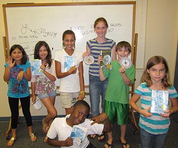 Mana-Tweens show off their artwork.