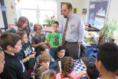 Library Director Mike Sullivan speaks with young patrons.