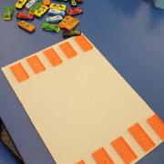 Photograph of a Manipulation Station table toy cars