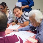 Nepali and Burmese-speaking patrons learn about financial literacy. Nepali and Burmese-speaking patrons learn about financial literacy.