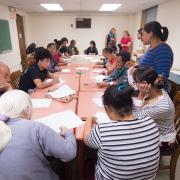 Nepali and Burmese-speaking patrons learn about financial literacy. Nepali and Burmese-speaking patrons learn about financial literacy.