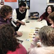 Participants playing a board game 